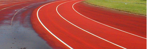 Spray cleaning operation on an athletics track Spray cleaning operation on an athletics track